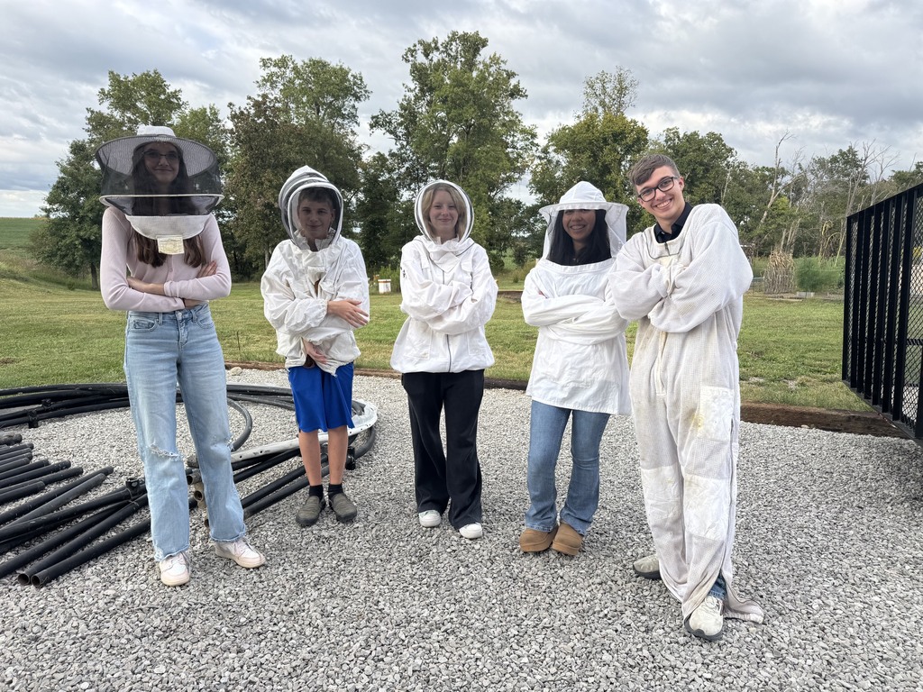 Students gearing up to approach an active hive