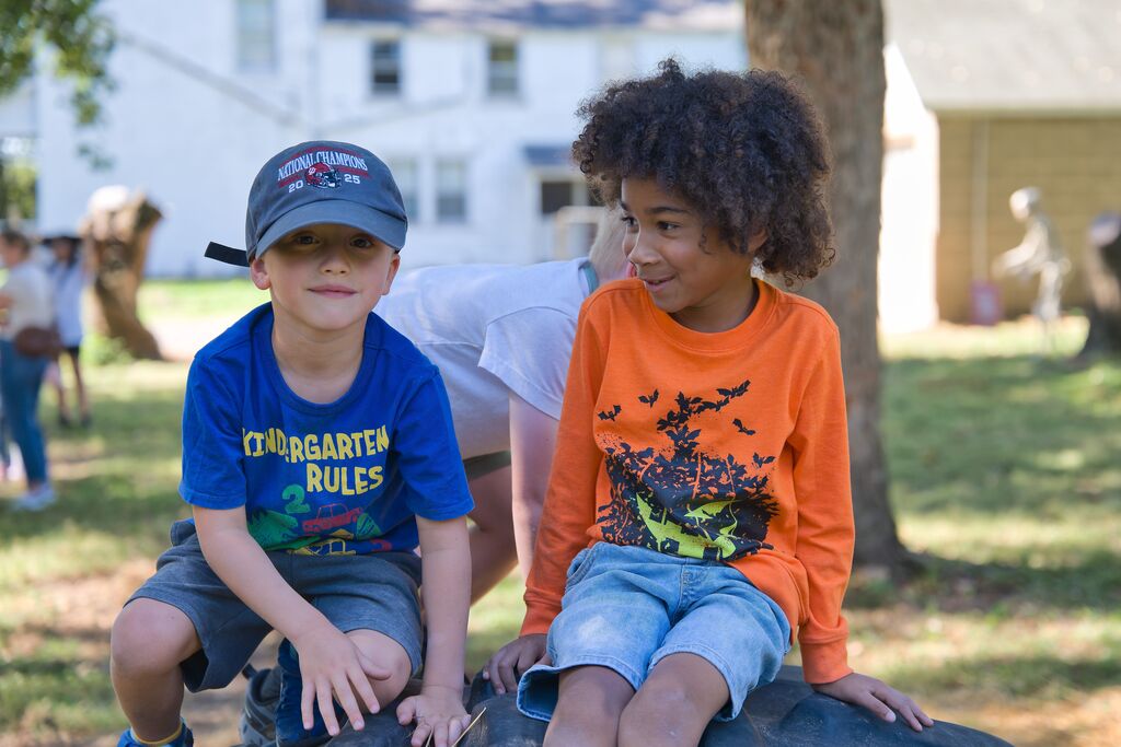 Two boys laughing and having fun at Hippie Hillbilly Farm.