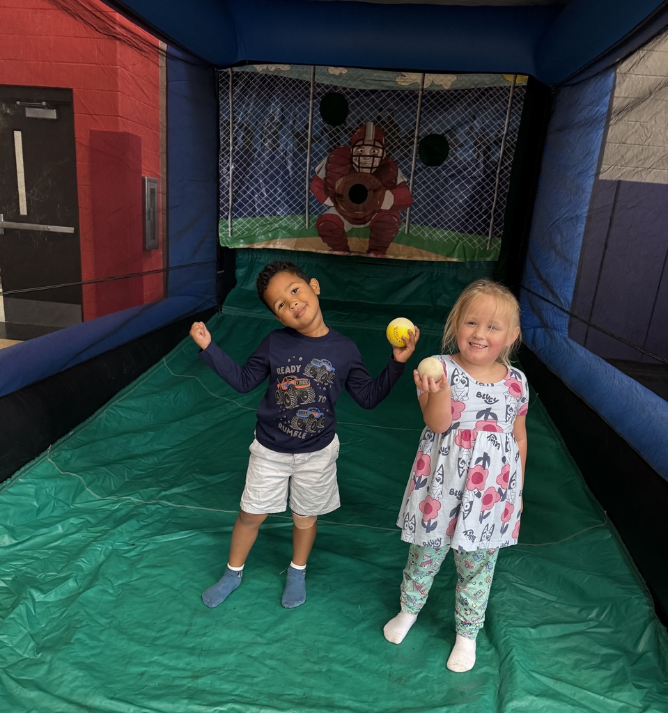 Wingate students enjoying the inflatables reward party