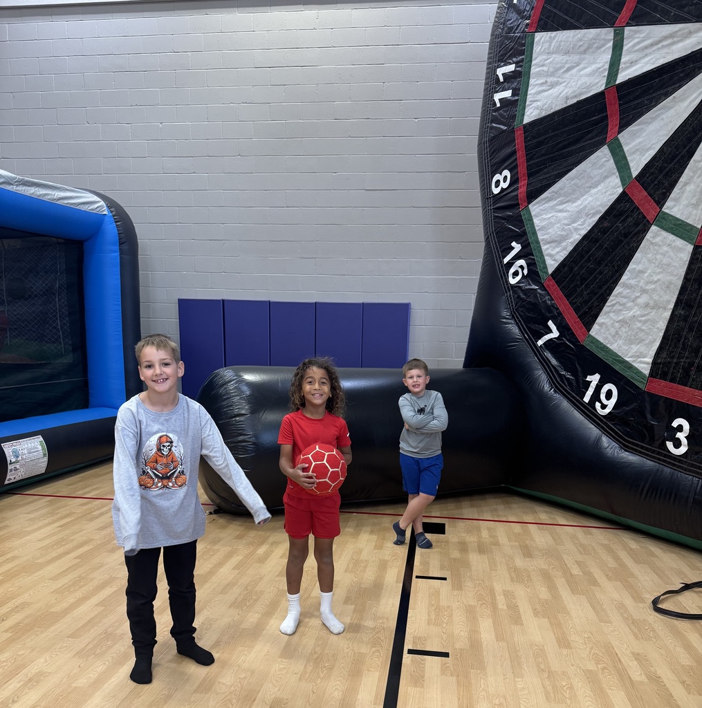 Wingate students enjoying the inflatables reward party
