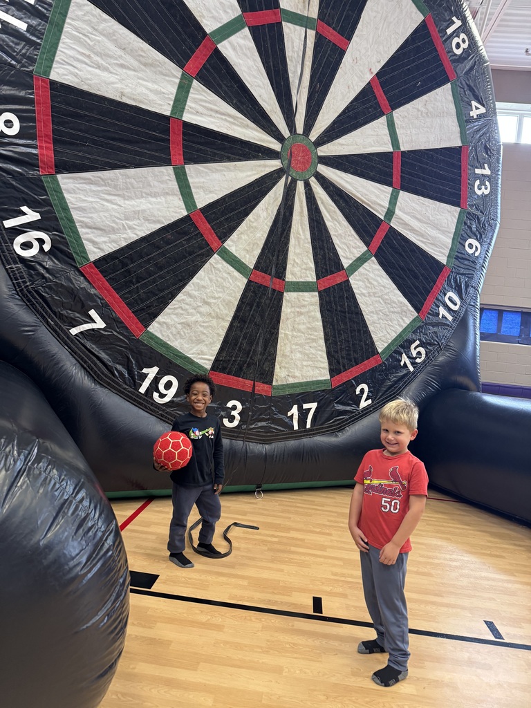 Wingate students enjoying the inflatables reward party