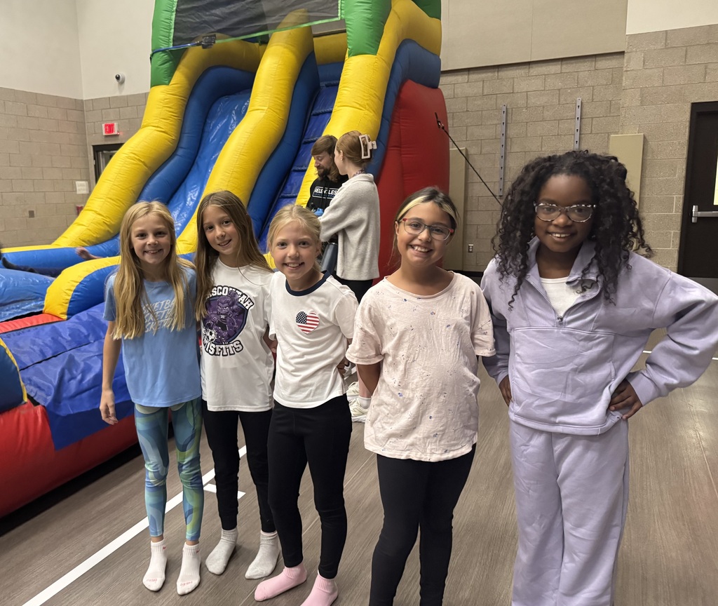 Wingate students enjoying the inflatables reward party
