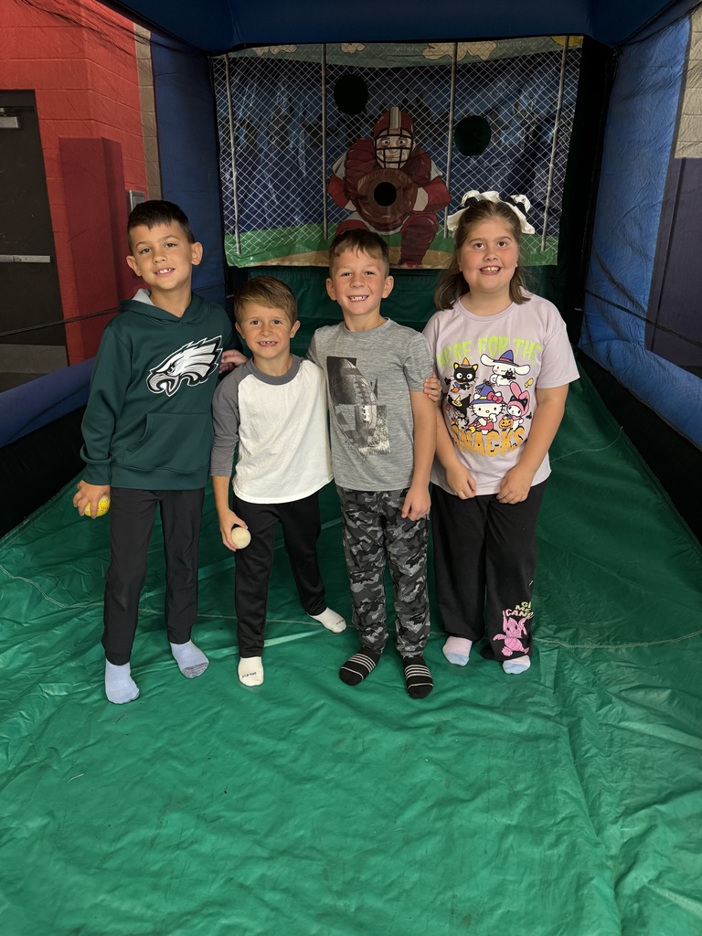Wingate students enjoying the inflatables reward party