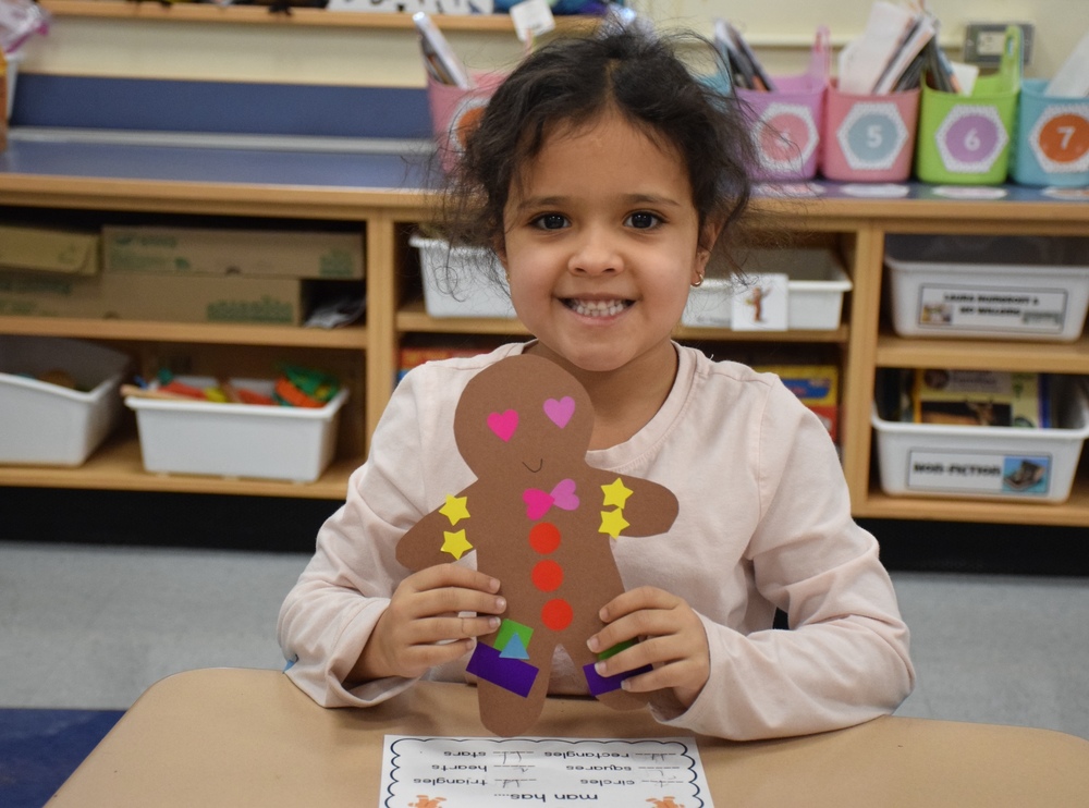 FFE Students holding hand-made Gingerbread man