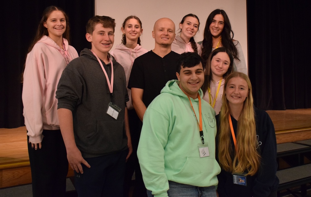 Deaf comedian Sandro Hatibovic pictured with students who attended the ASL Comedy show