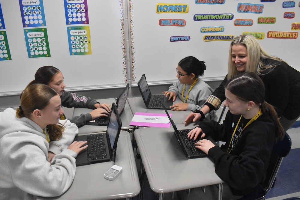 Marin, berner and unqua technology coach workong with berner students