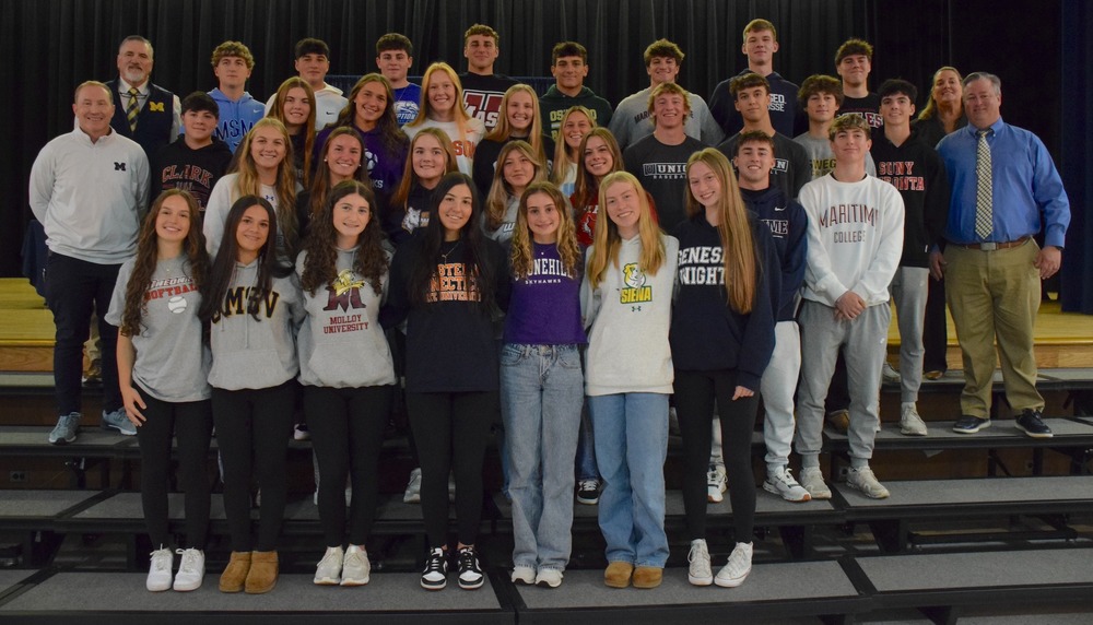 Dr. Brennan and Mr. Rath pictured with Fall Athletes at signing ceremony