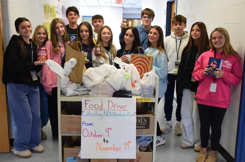 ames students with collection for their annual Thanksgiving food drive