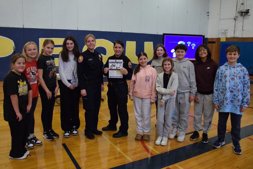 NCPD officers speaking with Berner students about online and bicycle safety