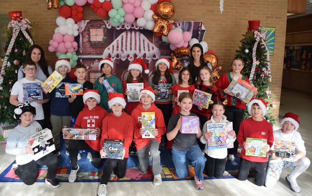 Birch Lane students displaying toy drive collections