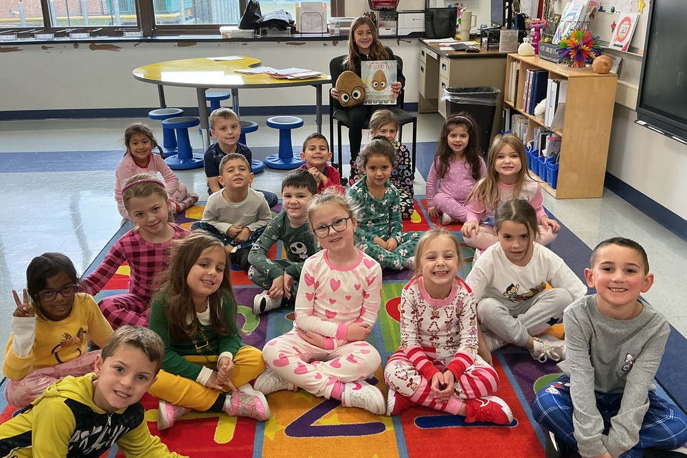 Ava Y reading to Mrs. Duffy