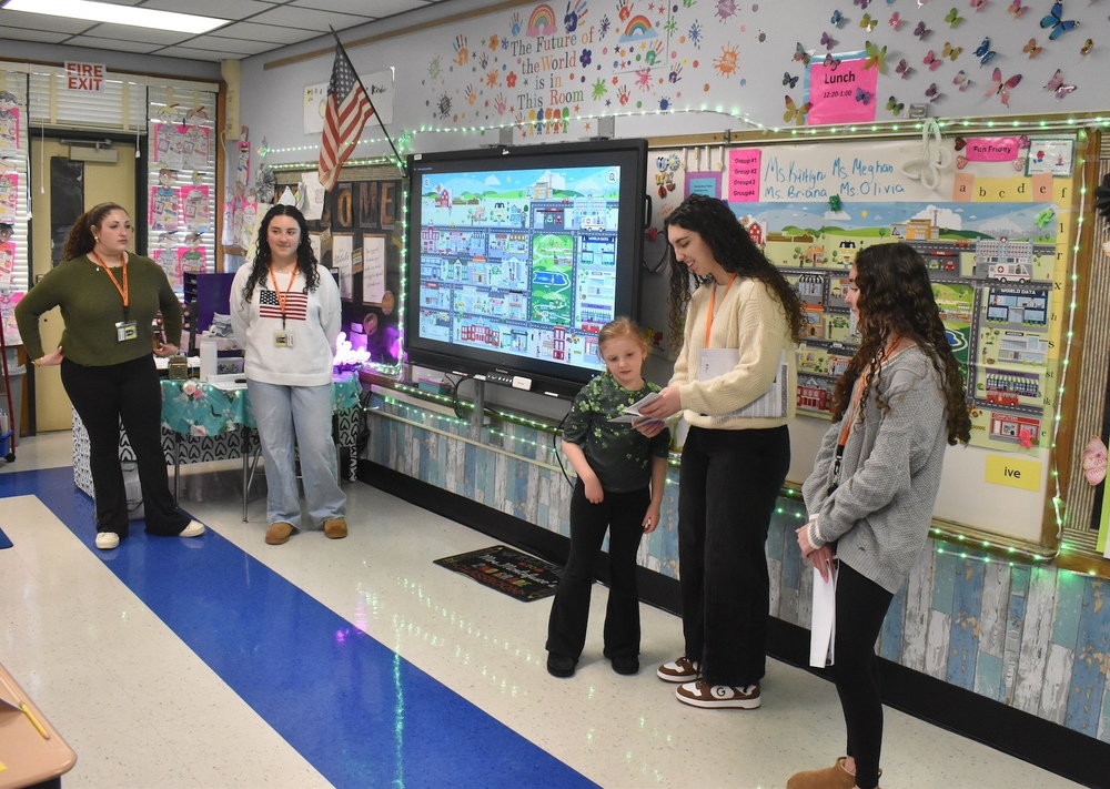 MHS Junior Achievement High School Heroes working with second graders