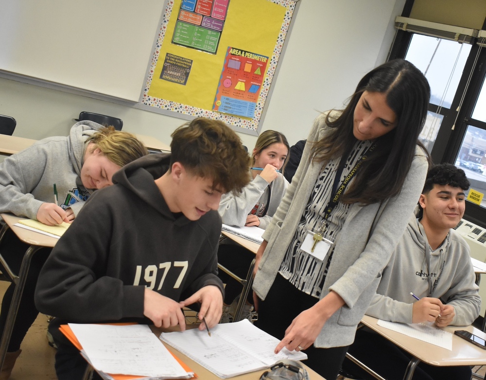 Secodary Math coach Carol Dacey working with students