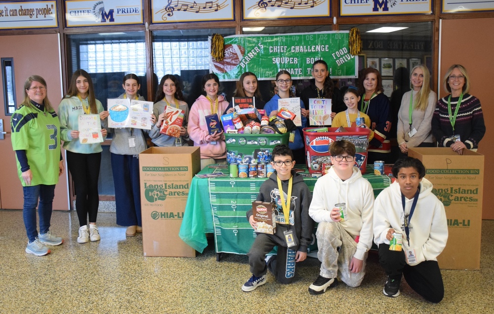 Berner students displaying their Souper bowl food collection
