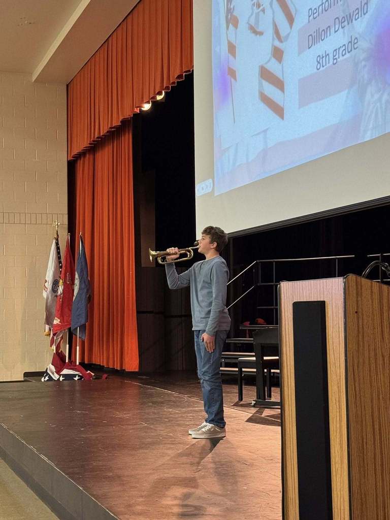 8th Grader, Dillon Dewald, performing Taps