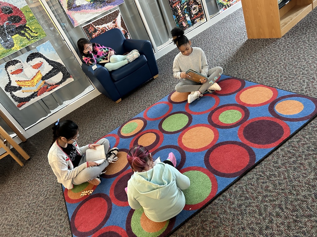 Students reading in our media center