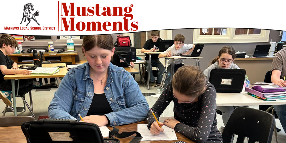 Students work on math assignments involving equations, volume, and probability in a classroom setting.