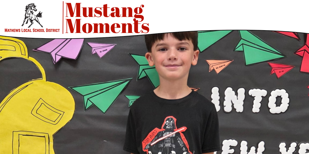 Fifth grader Joseph Fox, winner of the Mathews Elementary School Box Tops raffle, poses with his prize.