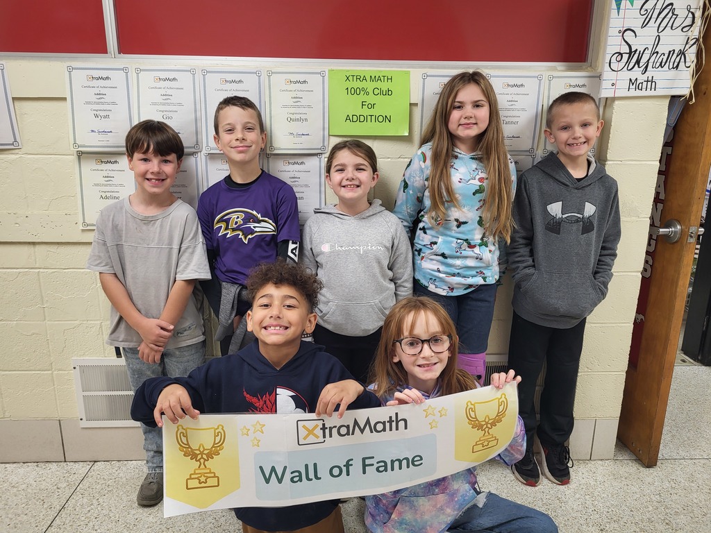 Mathews Elementary 3rd-grade Xtra Math Club winners smiling and holding their certificates.