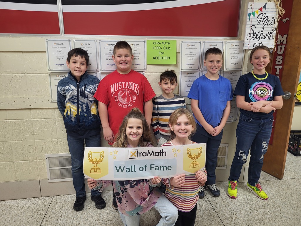 Mathews Elementary 3rd-grade Xtra Math Club winners smiling and holding their certificates.