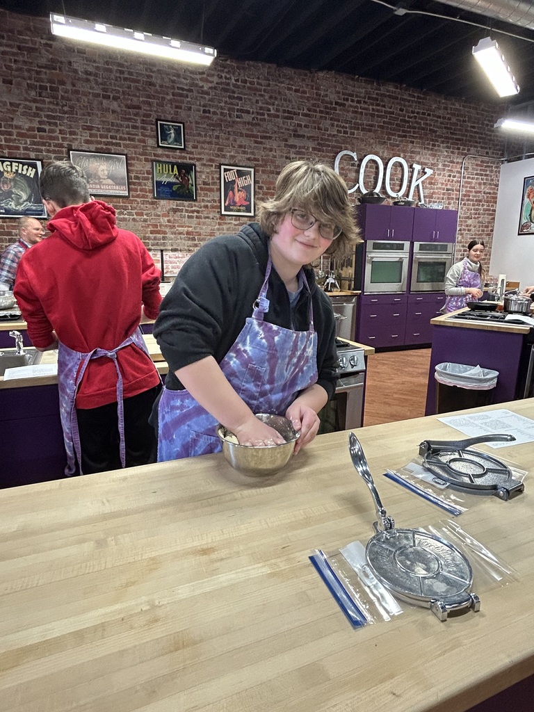 Students cooking tacos together