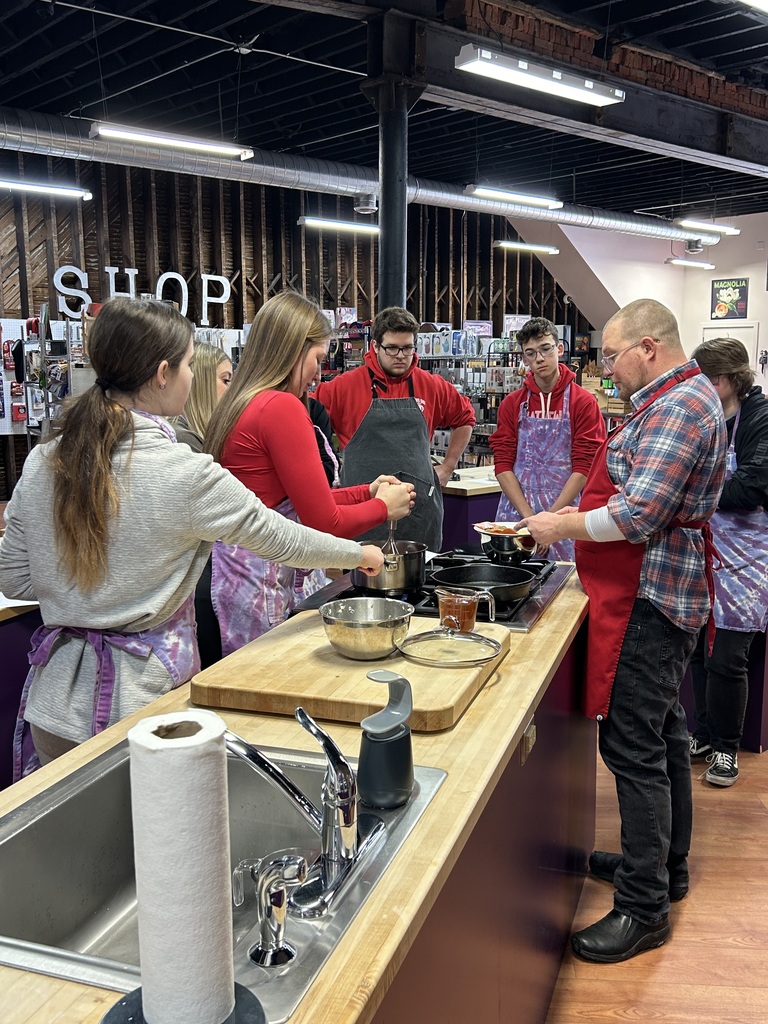 Students cooking tacos together