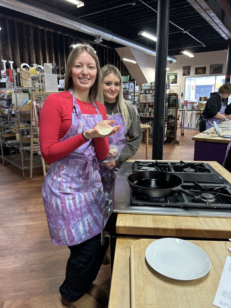 Students cooking tacos together