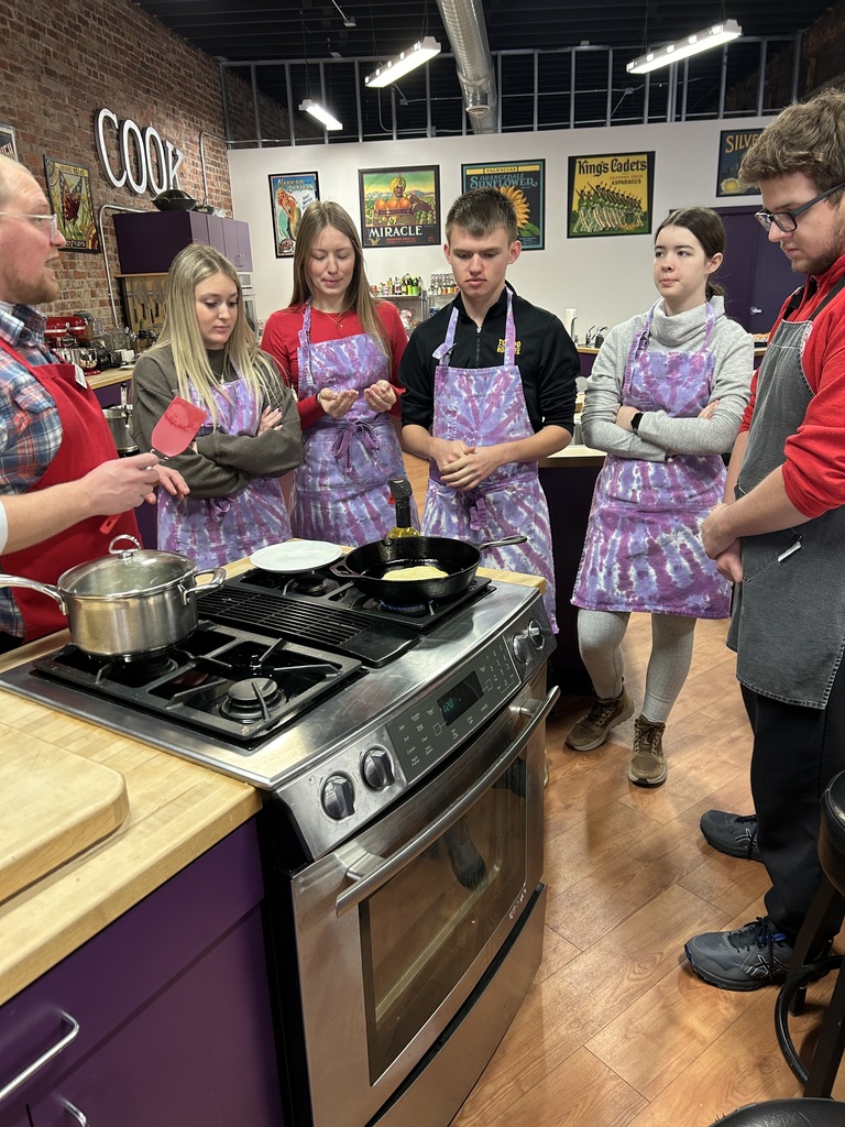 Students cooking tacos together