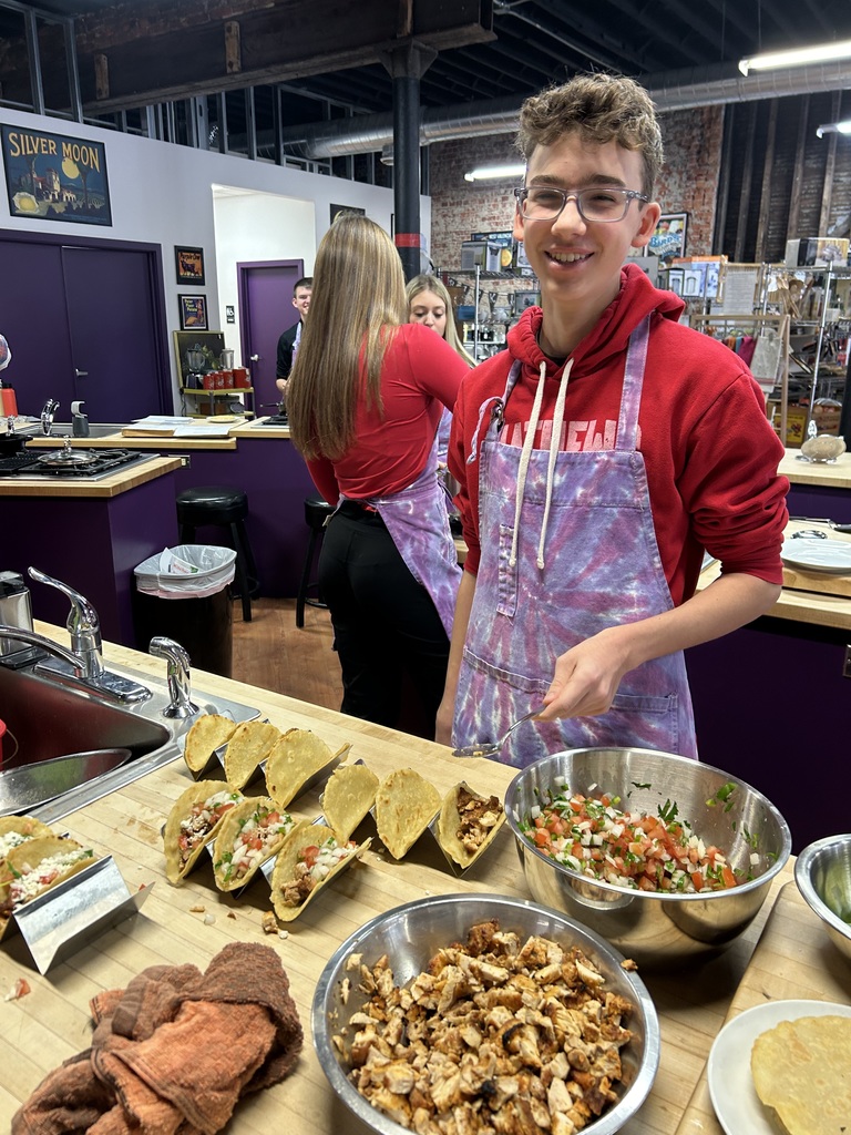 Students cooking tacos together