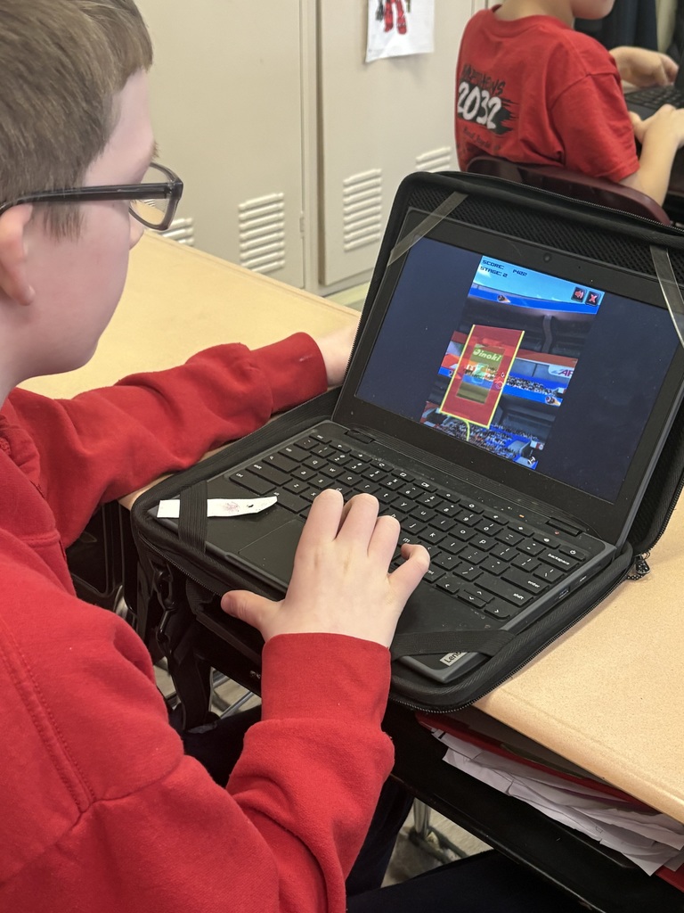 Students creating football histograms