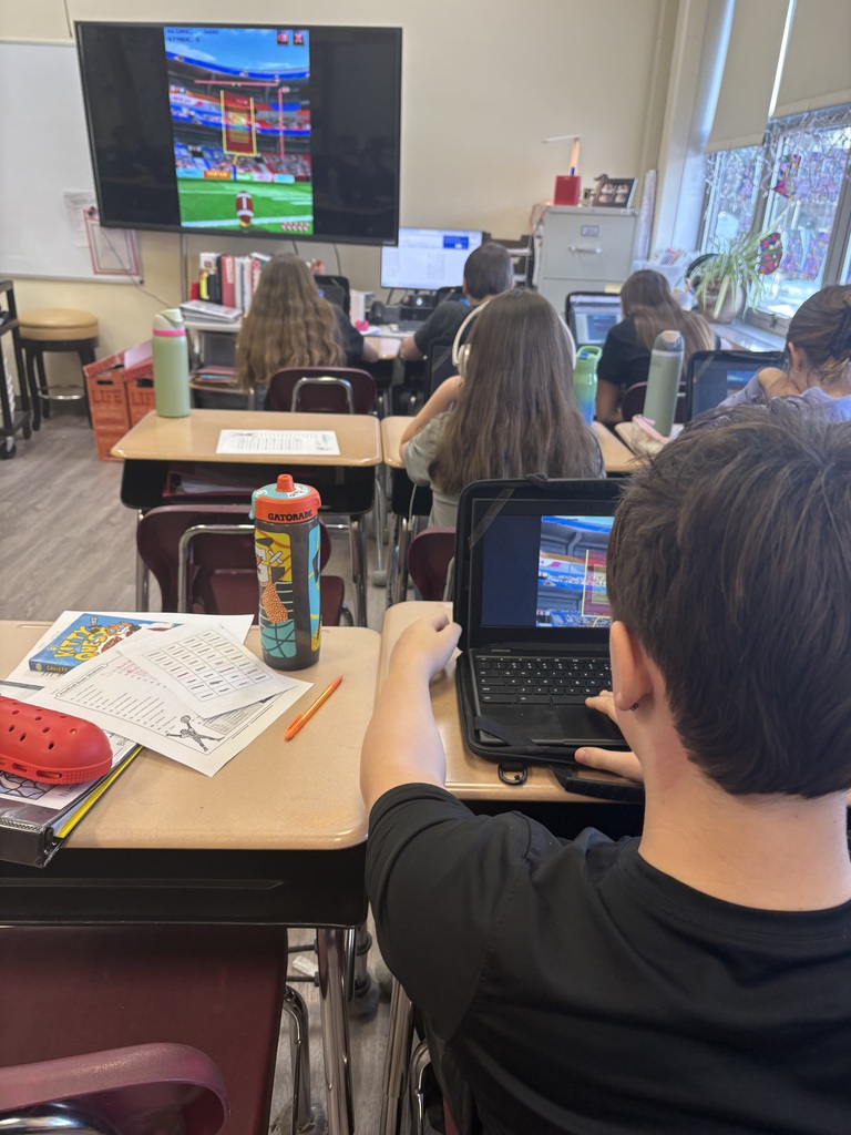 Students creating football histograms