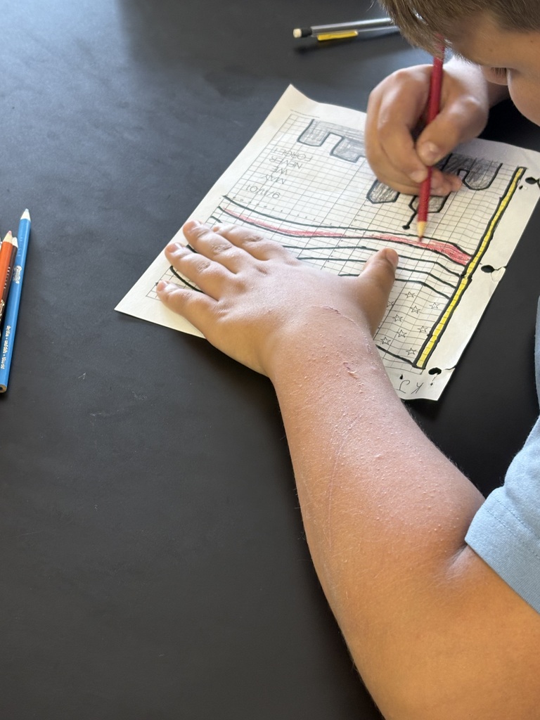 ixth- and seventh-grade students in Mrs. Konerth's math classes display math-based artwork created through order of operations pixel art and coordinate plane activities honoring Patriots' Day.