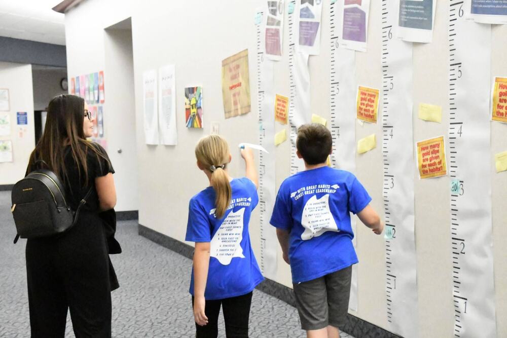 Picture of students giving a tour at their building