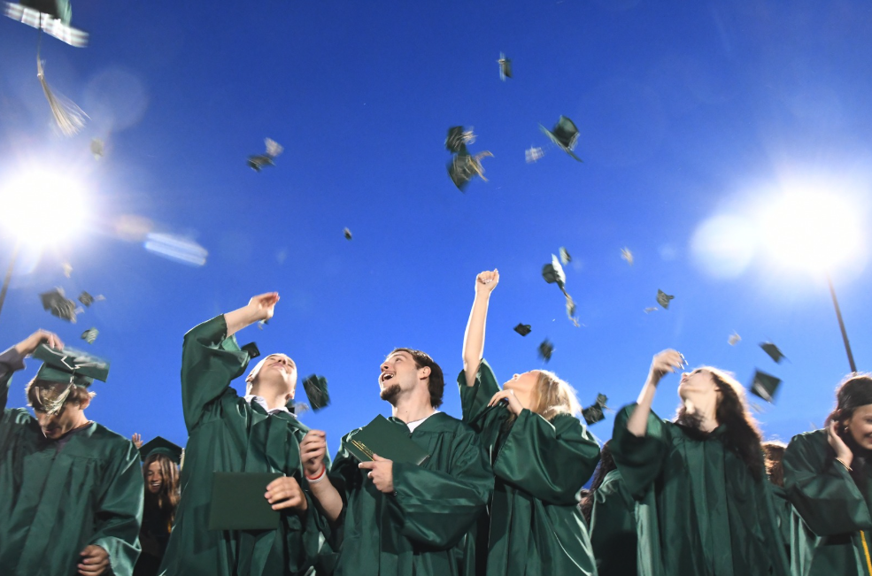 mhs grads tossing hats