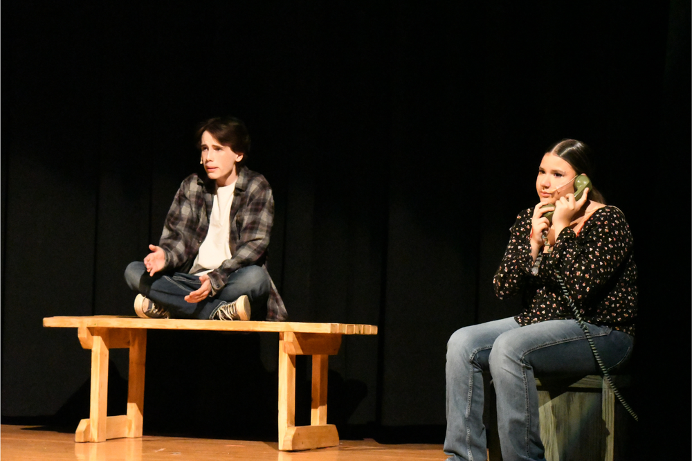 Two MHS seniors pefroming on stage during the play
