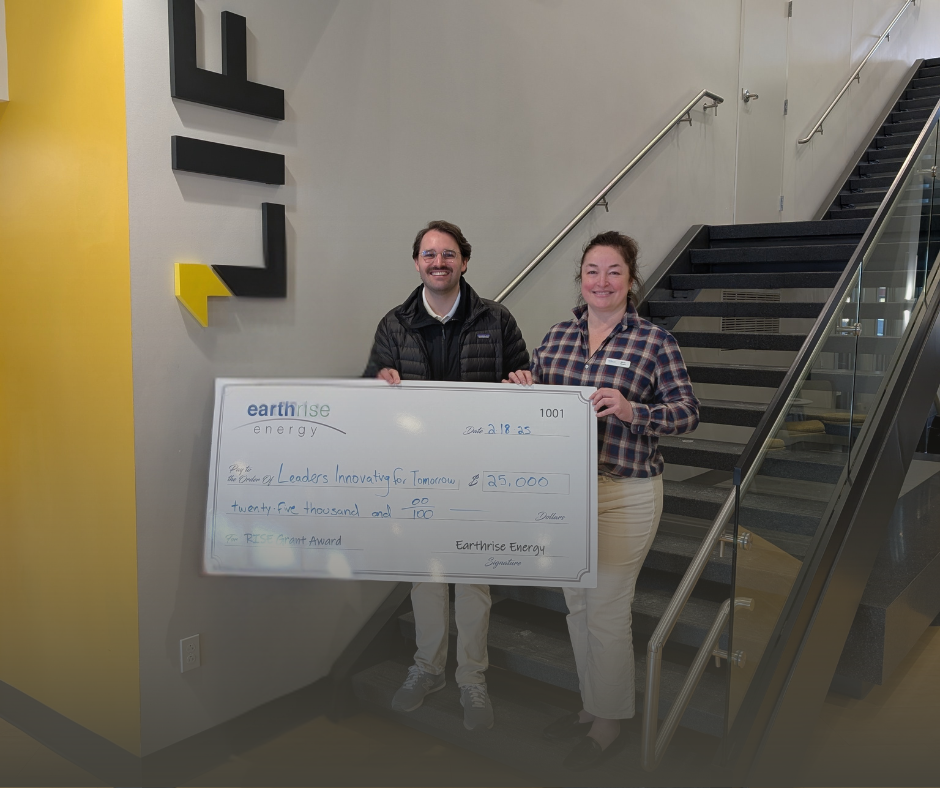 Photo of two earthrise energy reps presenting a grant check to LIFT central Illinois for $25,000