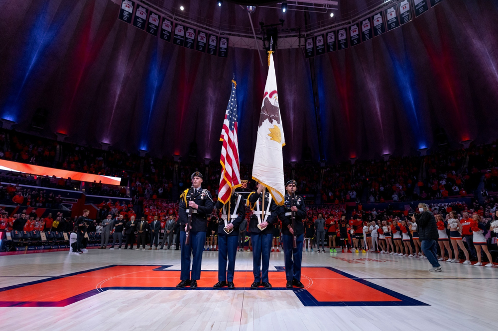 MHS JROTC presenting the flags at the U of I Basketball game