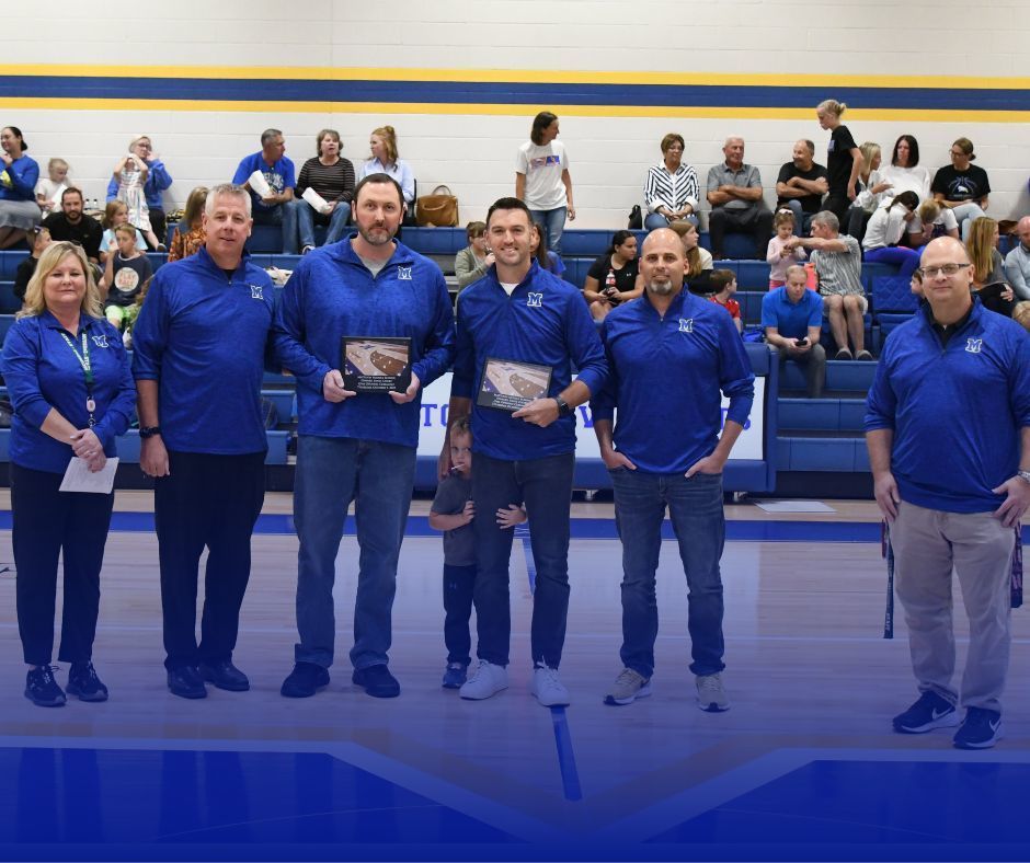 Photo of the Edward Jones Opening Celebration with admin and sponsor representatives on the MMS basketball court