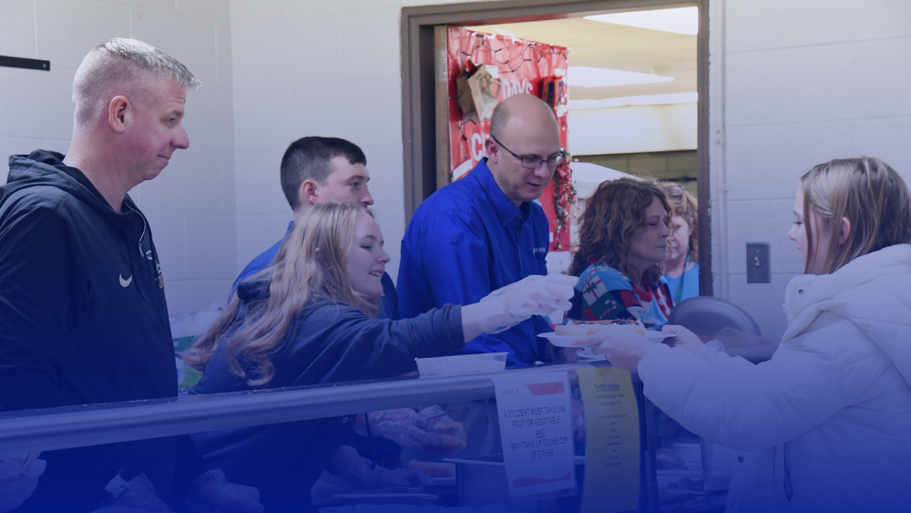 Staff members serving the community at the annual MMS chili supper