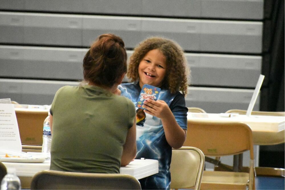 Riddle student playing a math game at the recent family night with parent