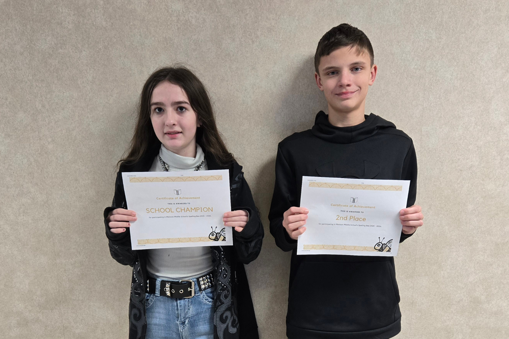 two MMS spelling bee champions pictured holding their award/certifications