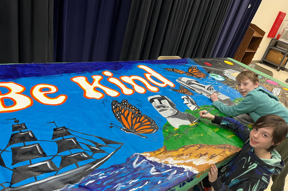 Two Riddle Students pictured painting the new school mural