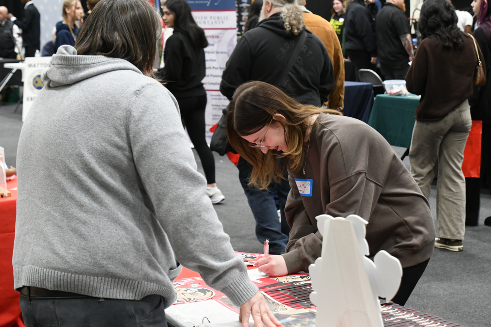 MHS Futures Day. Student speaking with a college rep