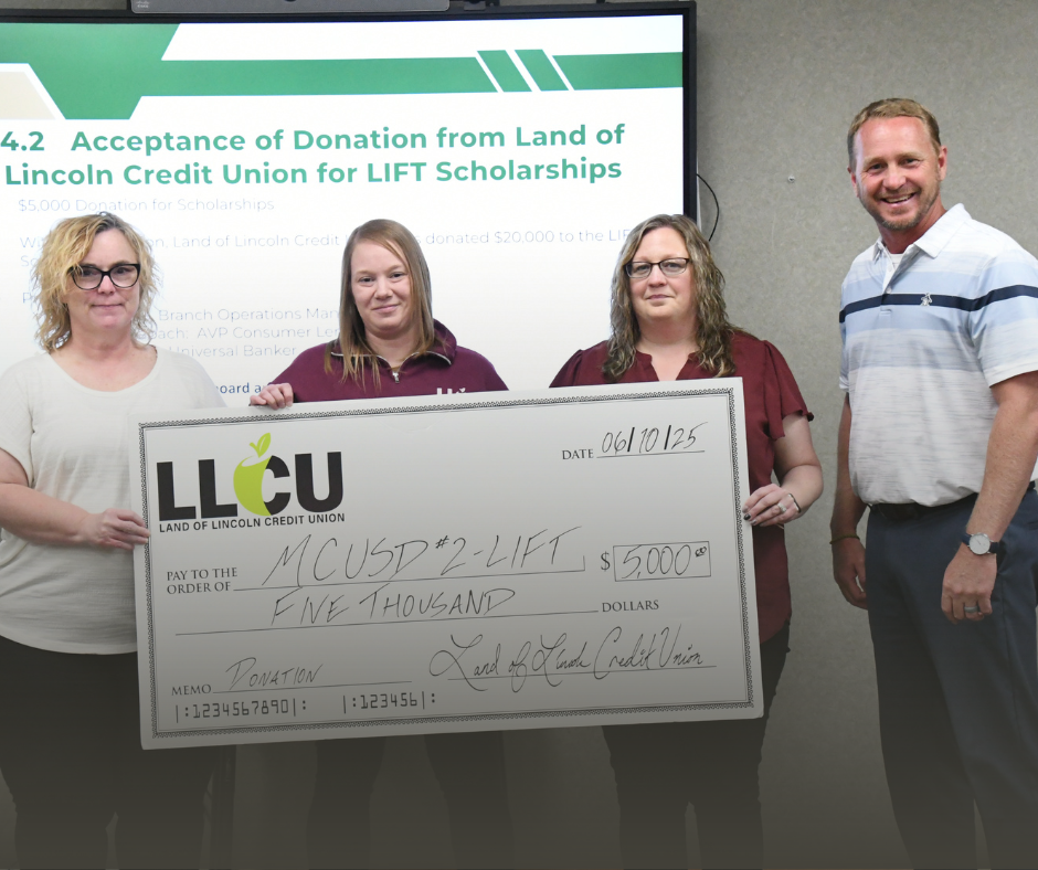 Photo of three reps from Land of Lincoln Credit Union holding up a check and presenting it to Ryan Ghere, a LIFT representative.
