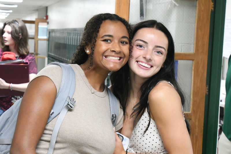 two mhs band students posing in the hallway