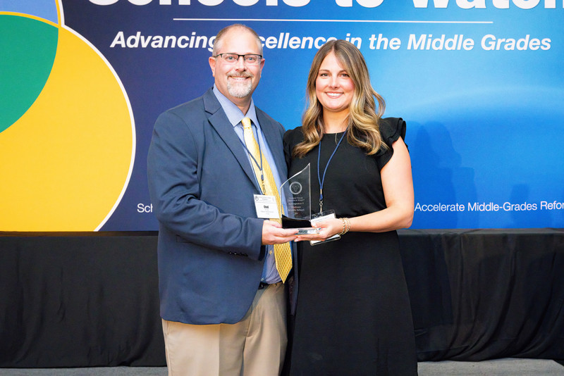 photo of MCUSD2 assistant Superintendent and MMS assistant principal accepting the Horizon Schools to Watch award