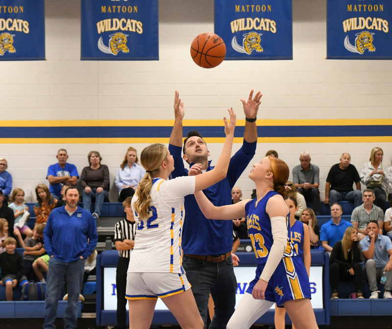 MMS Gym Court Sponsor helping with the tip off of the MMS girls basektball game vs st. John