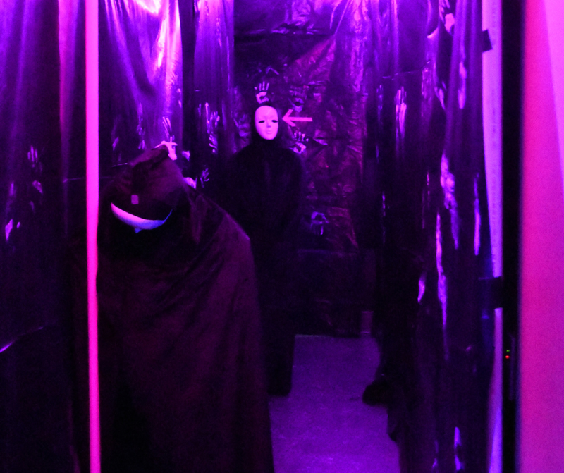 Spooky masked person in the LIFT Tower of Terror Haunted House