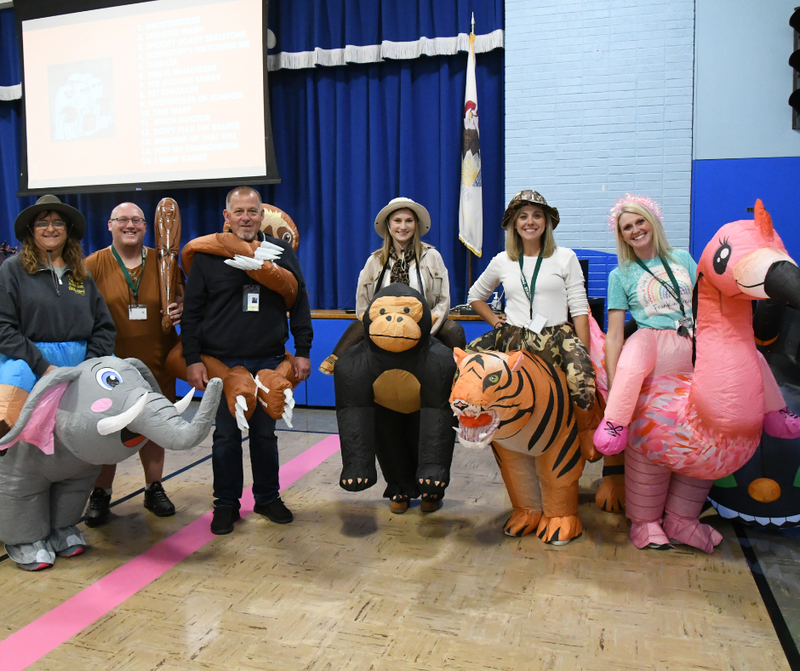 Staff dressed up in inflatable animal costumes at the Franklin Trick or Treat event