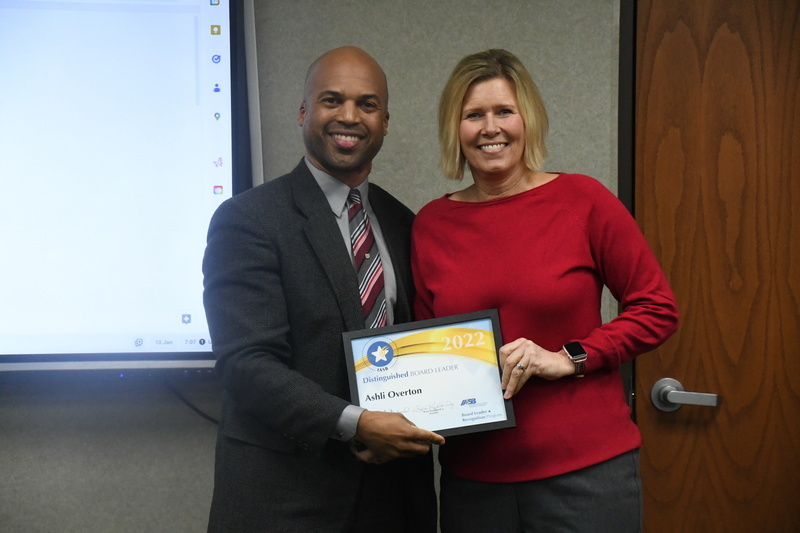 Dr. Perry Hill awarding Ashli Overton